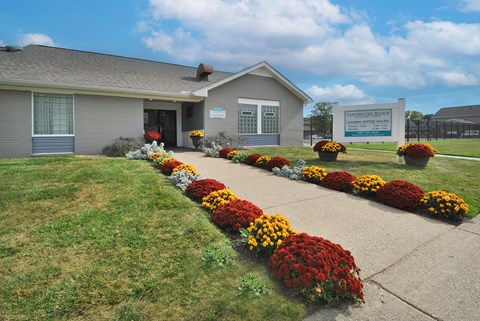 Leasing office at Farmbrooke Manor Apartments in Clinton Township MI with welcoming entrance and on-site parking