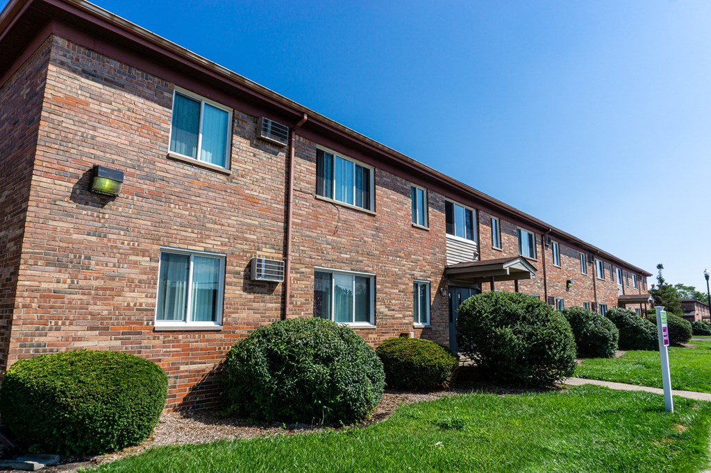 Exterior of apartment entrance at resident only parking at Golf Manor Apartments in Roseville, Michigan