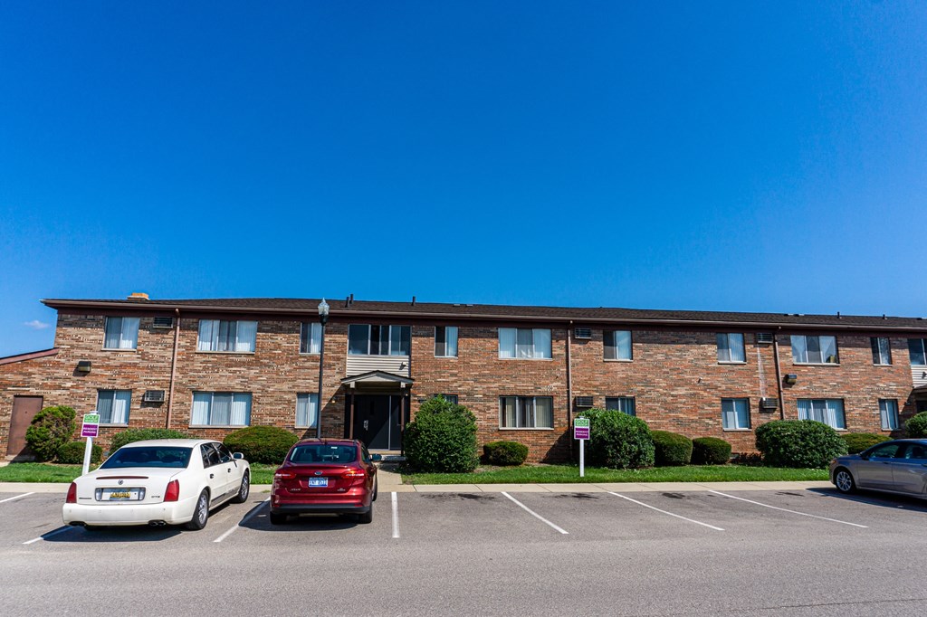 Exterior of apartment entrance at resident only parking at Golf Manor Apartments in Roseville, Michigan