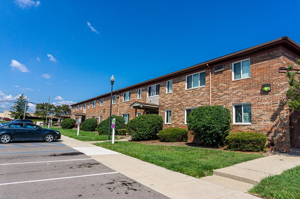 Exterior of apartment entrance at resident only parking at Golf Manor Apartments in Roseville, Michigan