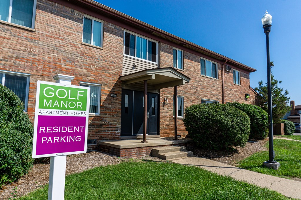 Exterior of apartment entrance at resident only parking at Golf Manor Apartments in Roseville, Michigan