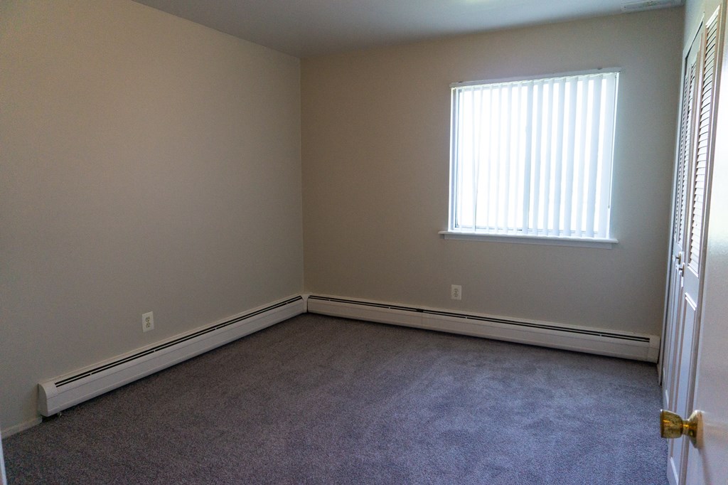Spacious bedroom at Golf Manor Apartments in Roseville, Michigan