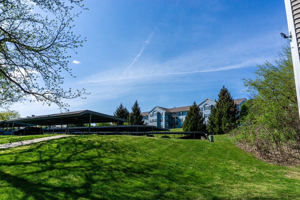 Open field and free parking space with carports. apartments for rent in Kalamazoo, MI near WMU Western Michigan University