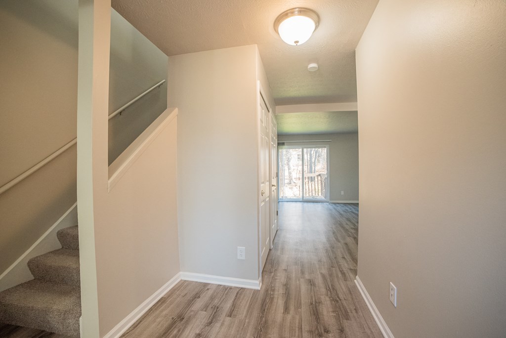 Spacious layout, stairs, and newly renovated wood floors at Westwind Townhomes in Lansing, Michigan