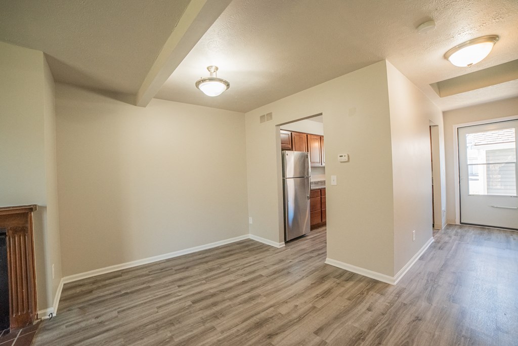 Spacious layout, dining room, kitchenand newly renovated wood floors at Westwind Townhomes in Lansing, Michigan