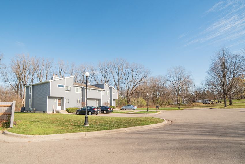 Building Exteriors and parking spaces at Westwind Townhomes in Lansing. Michigan