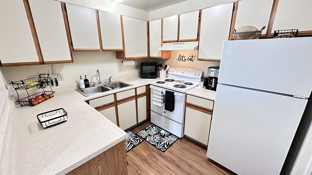 the preserve at ballantyne commons apartment kitchen with white appliances