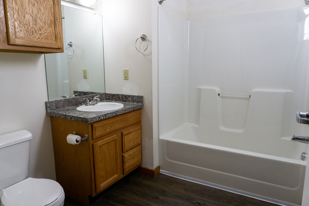 a small bathroom with a sink toilet and shower