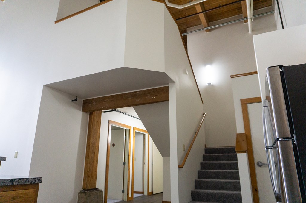 a view of the stairwell from the bottom of the stairs in a house