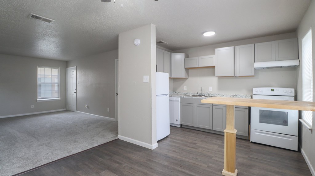 Modern kitchen with wood table at Hartford Commons Apartments
