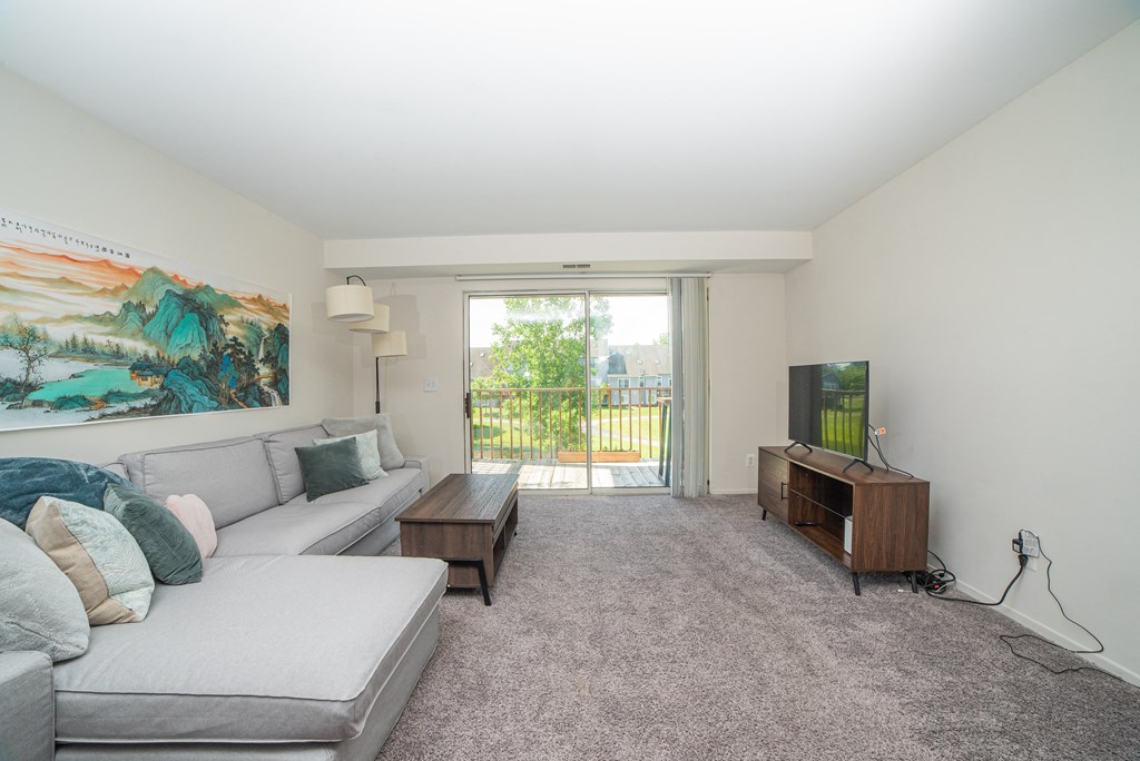Spacious and cozy living room at Cambridge Club Apartments in Ann Arbor, Michigan