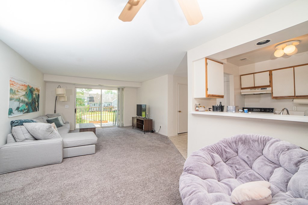 Spacious layout with living, dining, and kitchen at Cambridge Club Apartments in Ann Arbor, Michigan