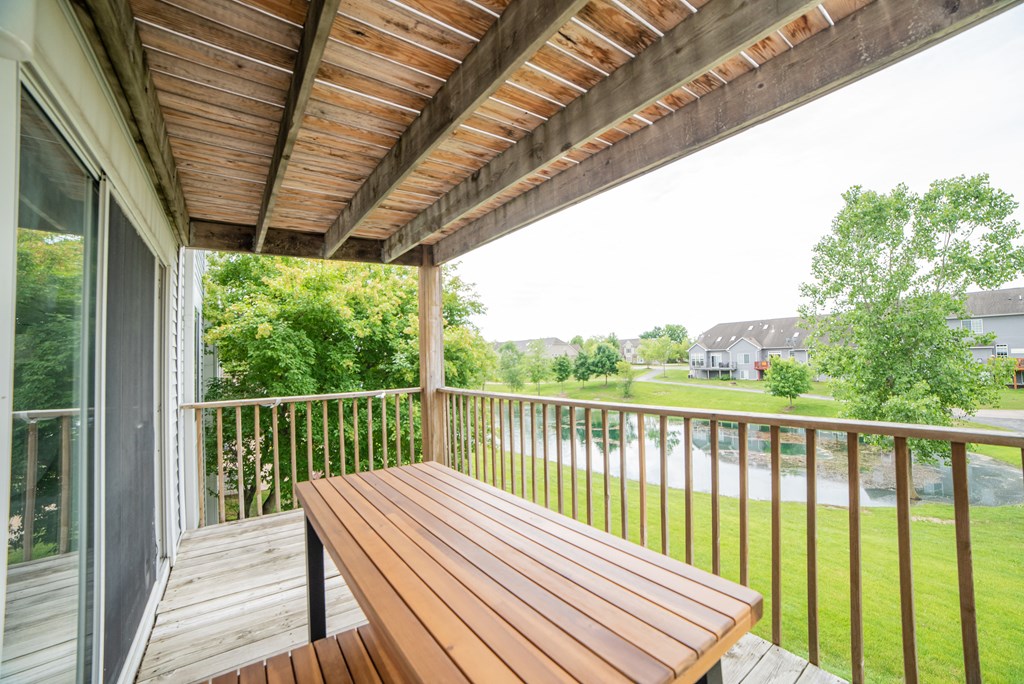 Balcony with a table and a great view at Cambridge Club apartments in Ann Arbor, Michigan