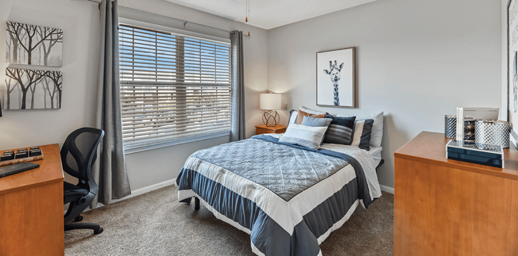 the preserve at ballantyne commons bedroom with bed and desk