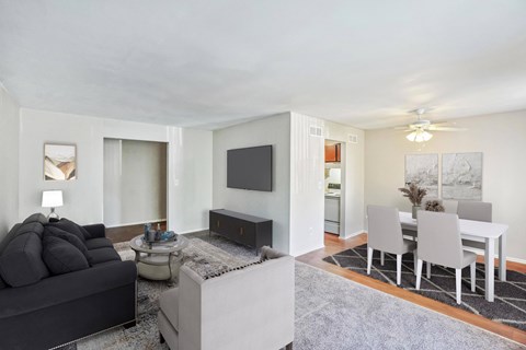 a living room with a couch and a table and a tv