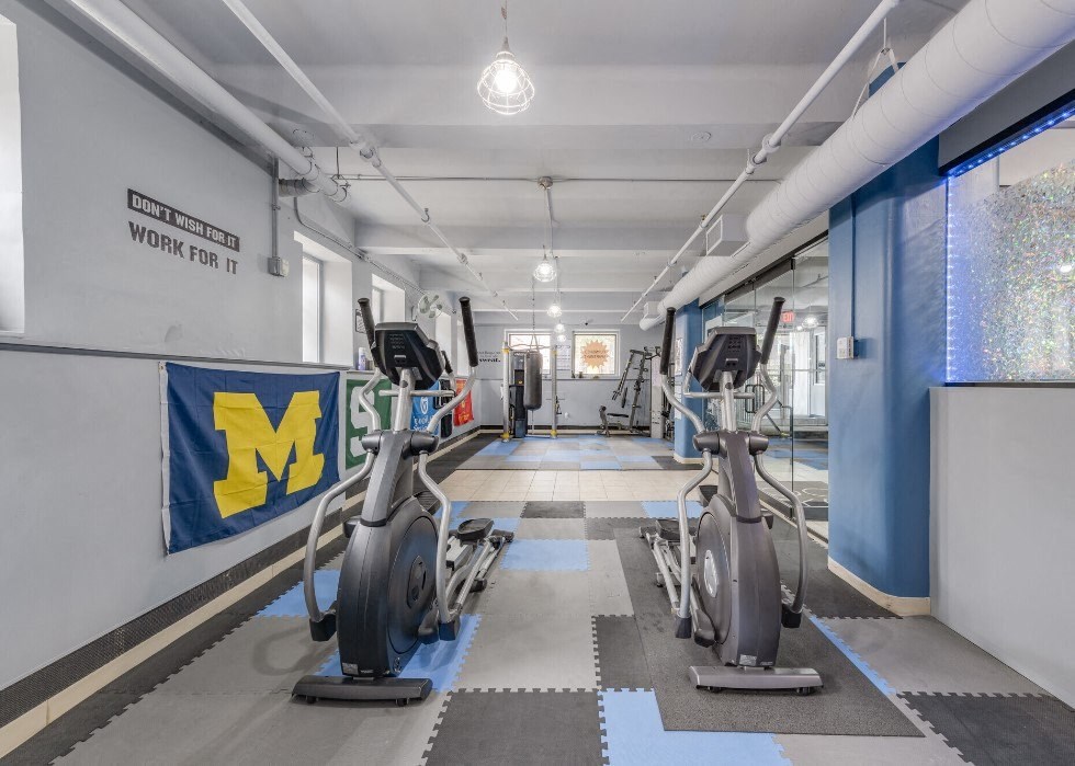 a gym with cardio machines and weight lifting at Lofts at 5 Lyon, in downtown Grand Rapids, MI
