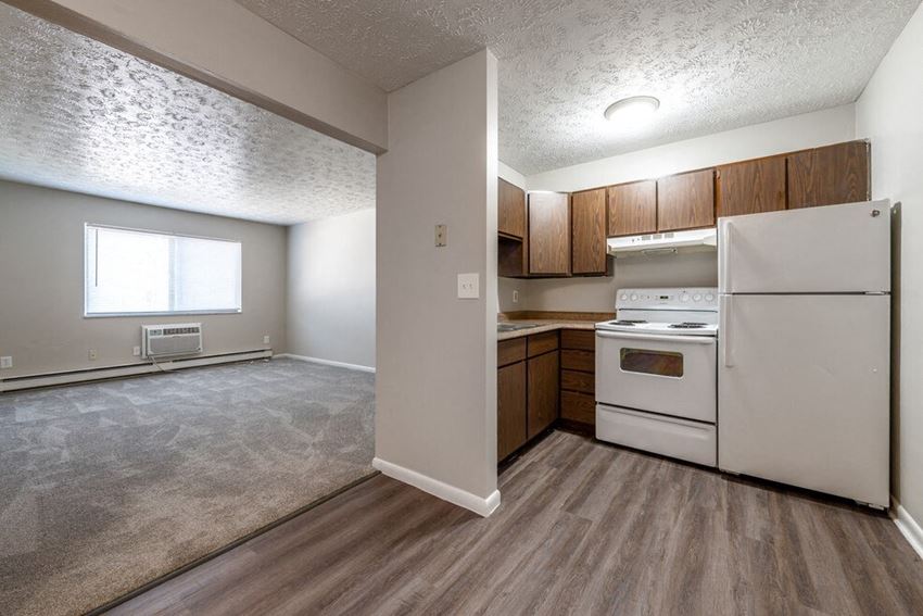 a kitchen and living room in an apartment at Timber Creek Apartments in Niles, Ohio