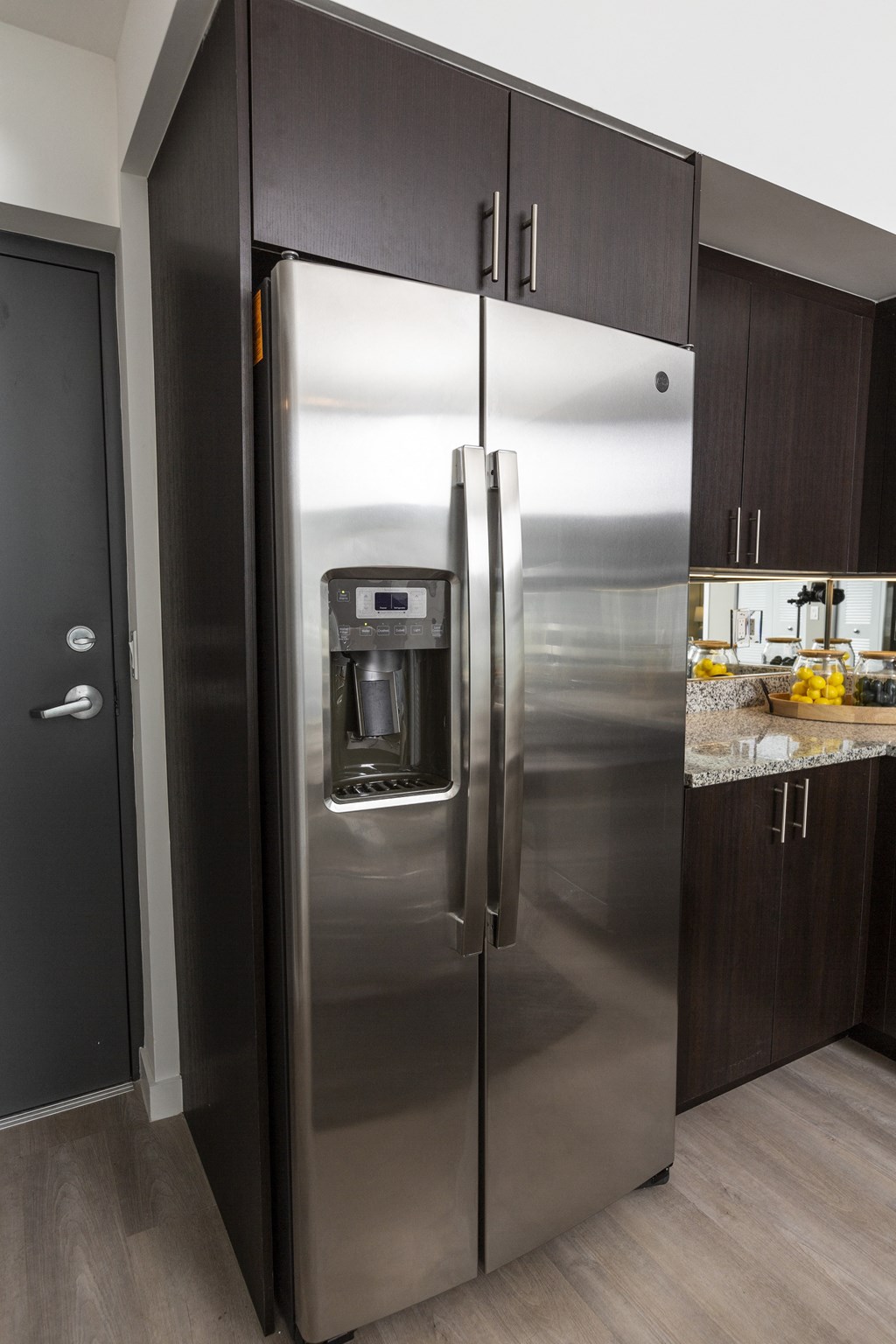 a stainless steel refrigerator in a kitchen
