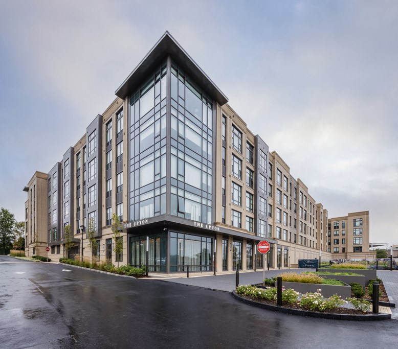 a large building with a street in front of it