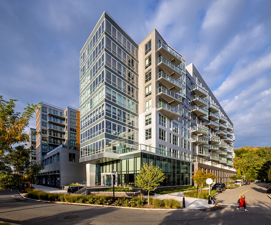 a rendering of a tall building on a city street