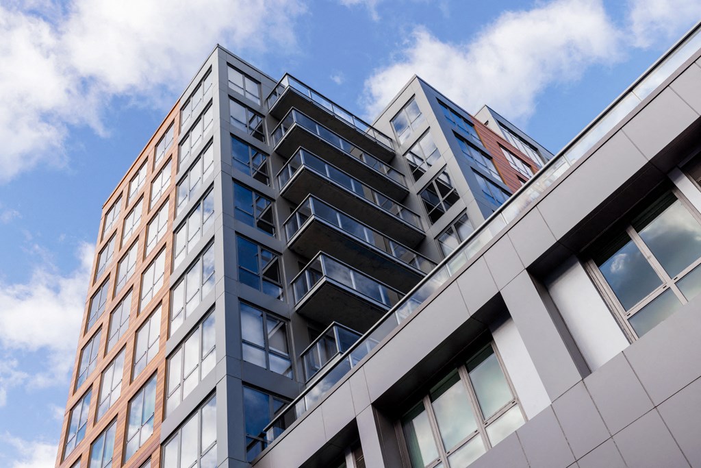 the view of a tall building from the street