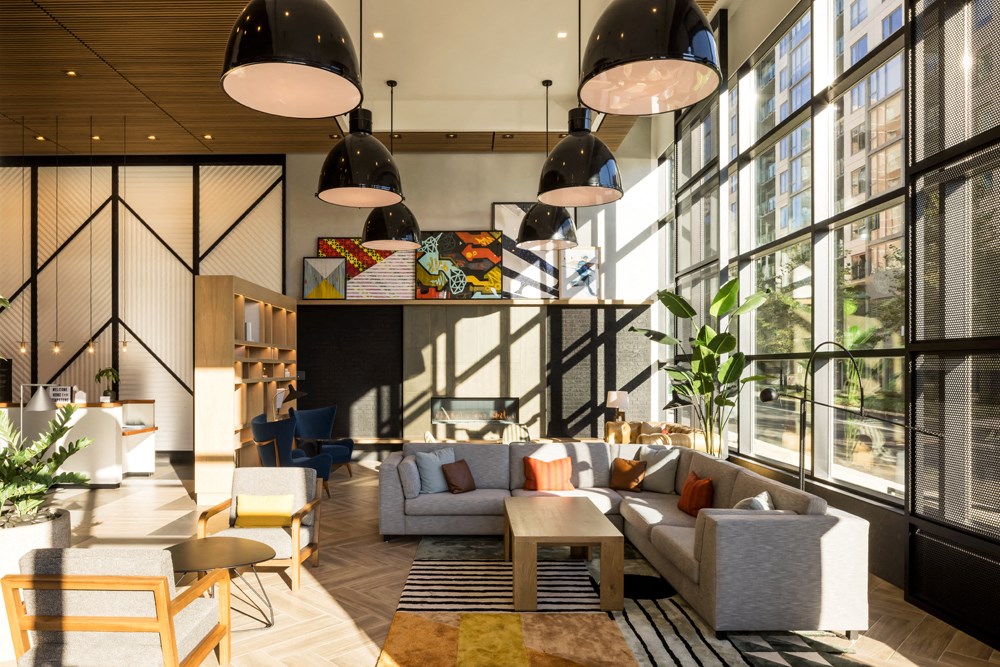the lobby of a hotel with couches and chairs