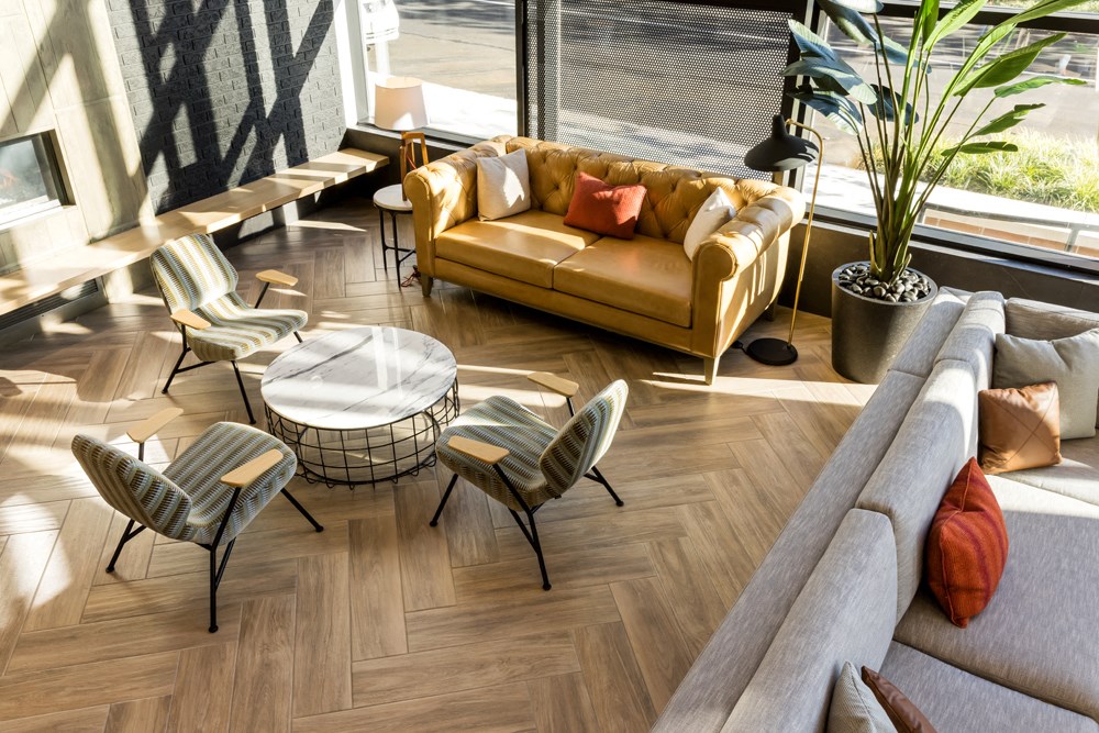 a living room with a couch and chairs and a table