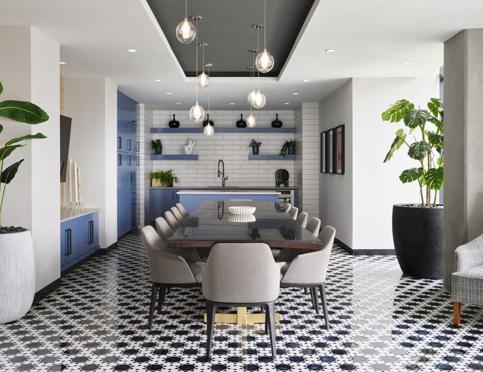 a dining room with a table and chairs and a kitchen