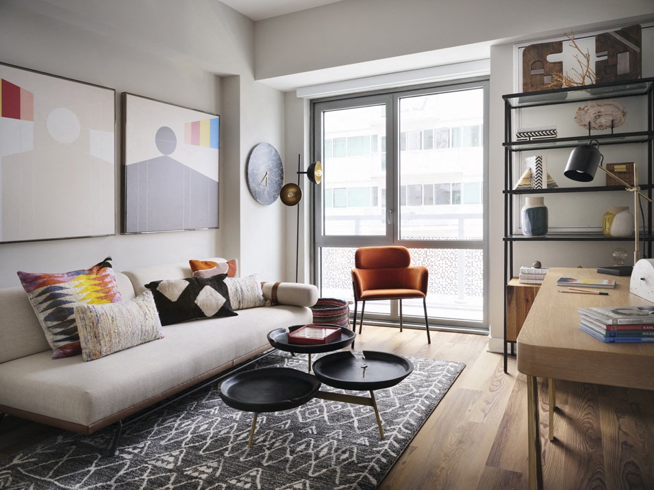 a living room with a couch and a chair and a table