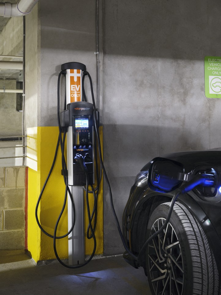a car is plugged in to a gas pump
