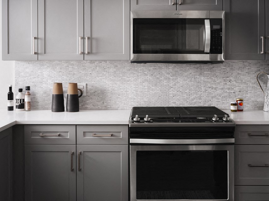 a kitchen with a stove and a microwave