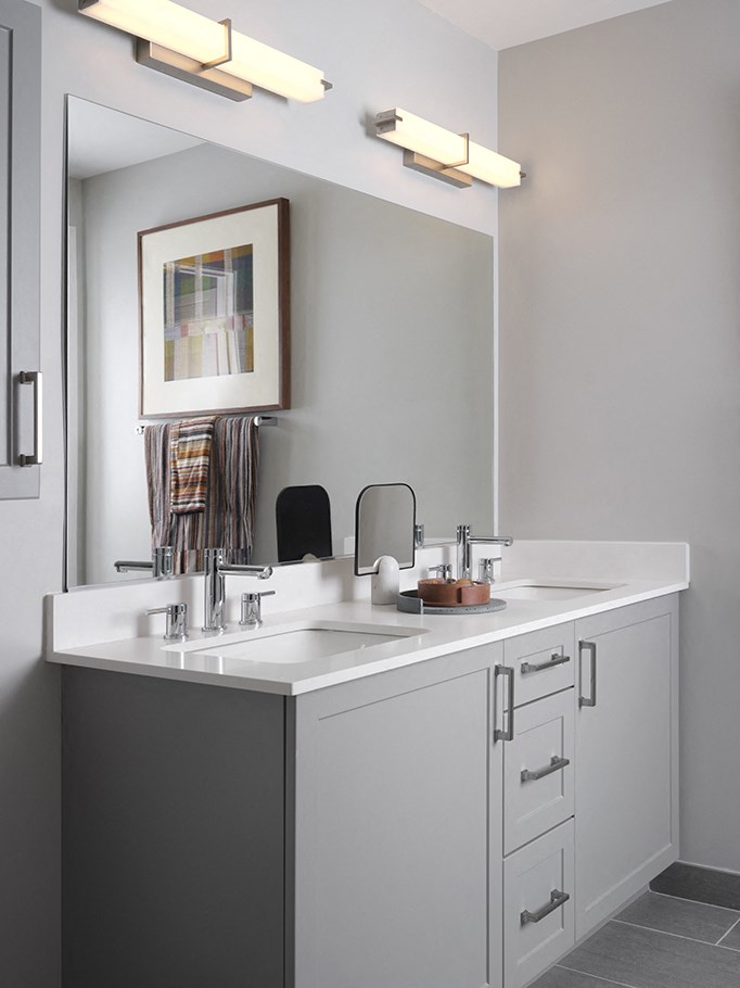 a white bathroom with a sink and a mirror