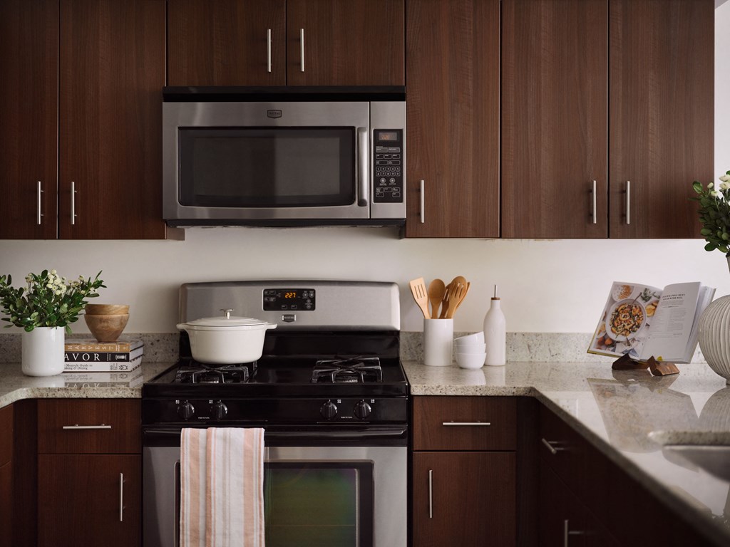 a kitchen with a stove and a microwave