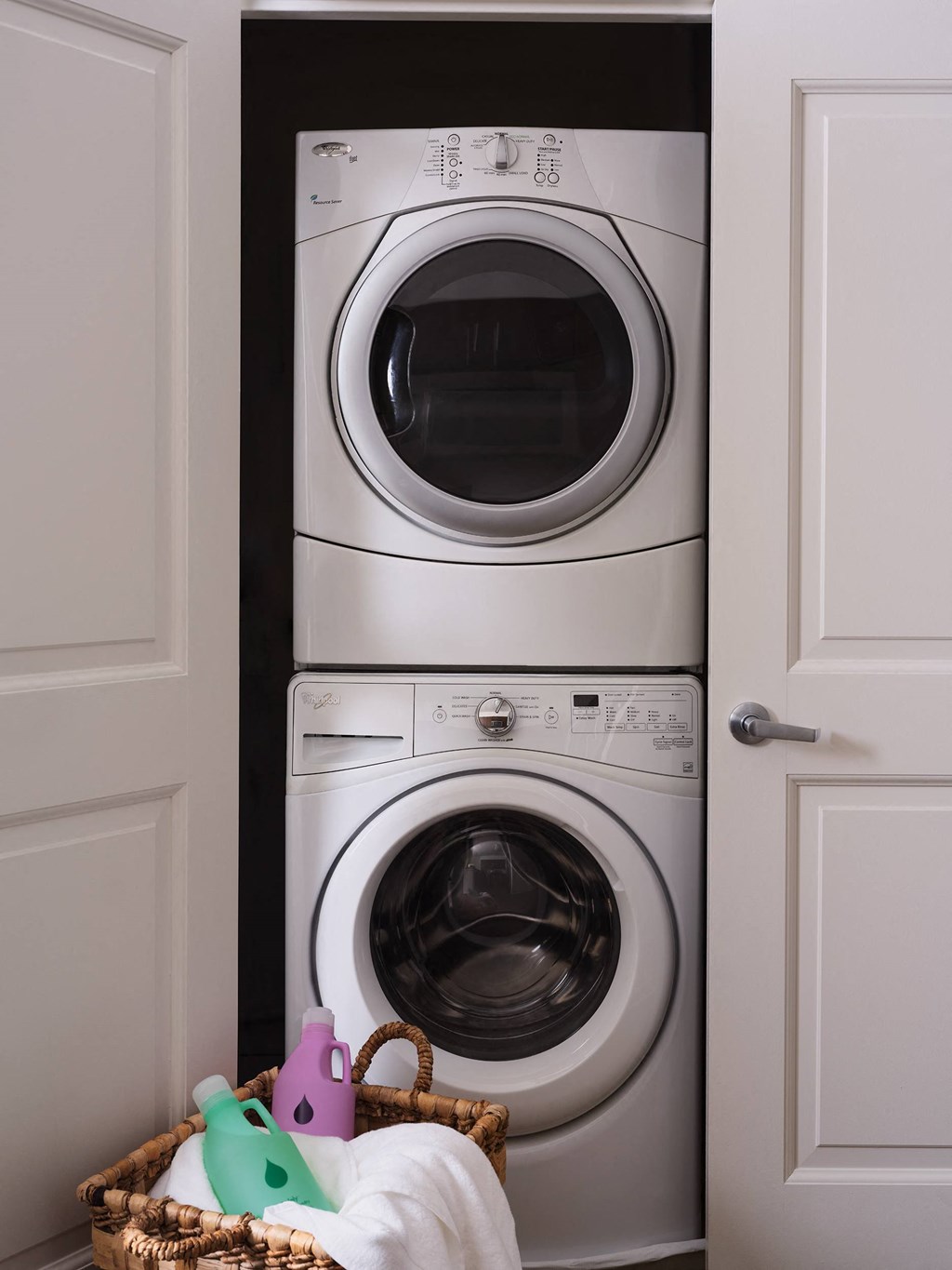 a front loading washer and dryer in a laundry room