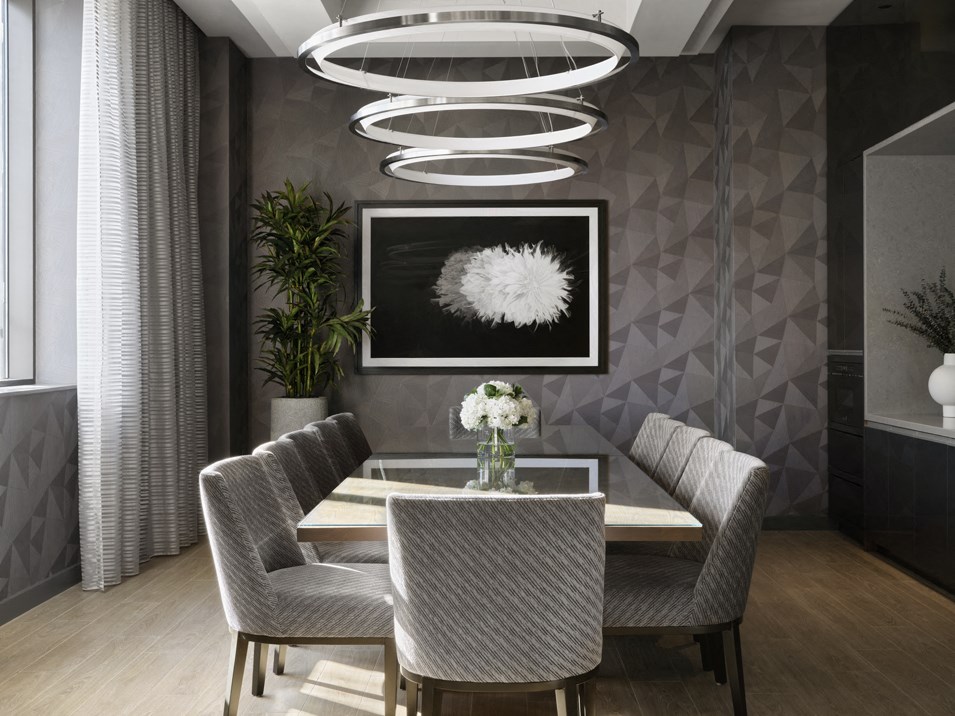 a dining room with a table and chairs