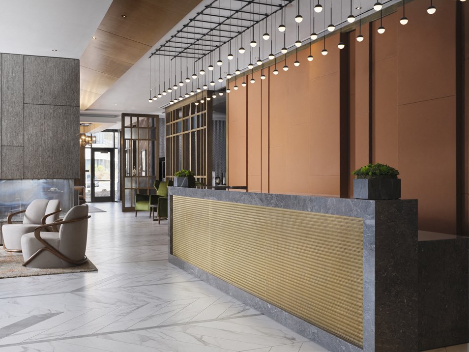 a lobby with a reception desk and chairs