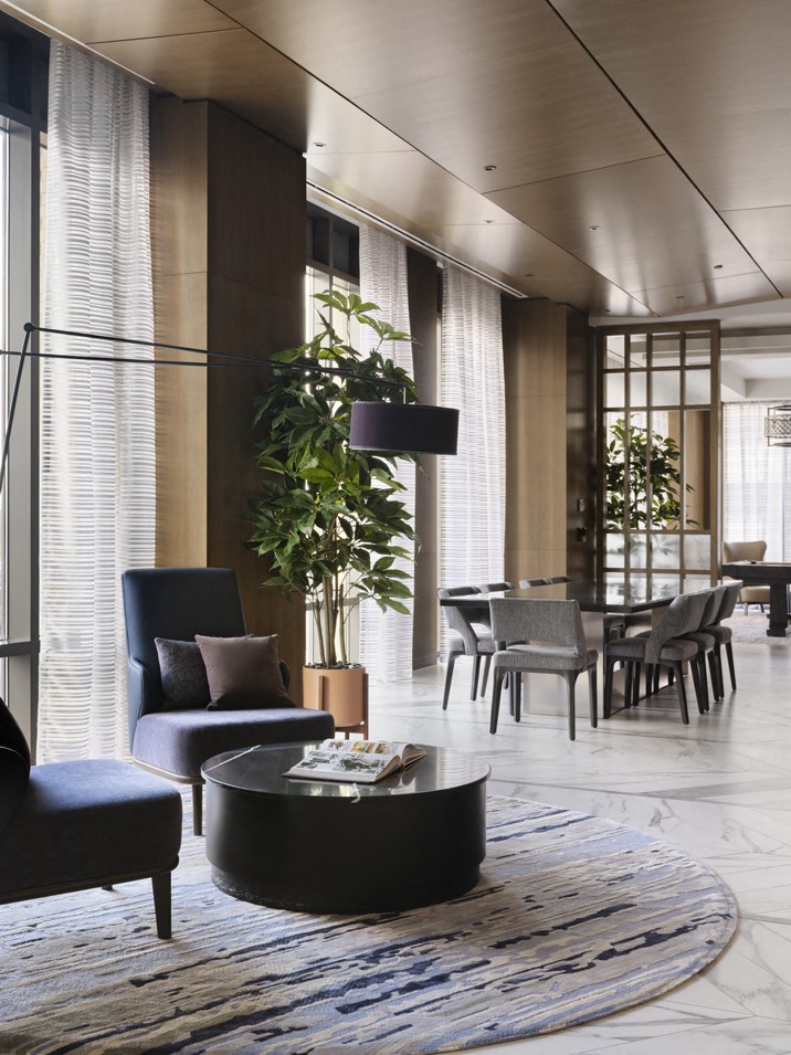 a living room with couches and chairs and a table