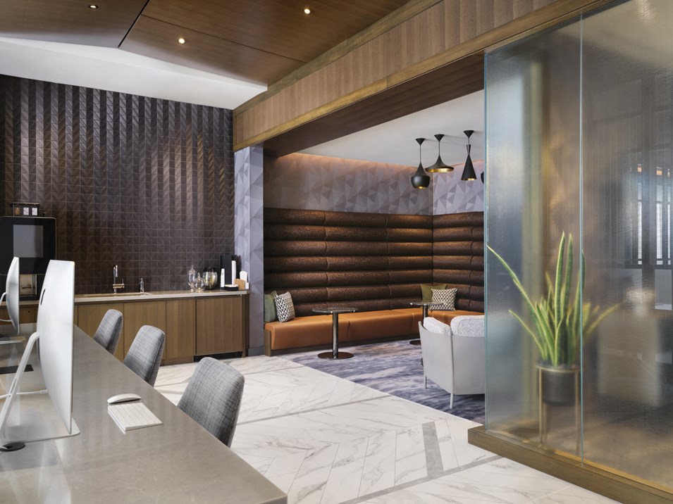 a conference room with a table and chairs and a couch