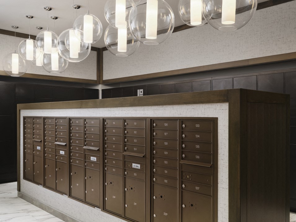 a view of the lockers and chandeliers in the lobby of a building