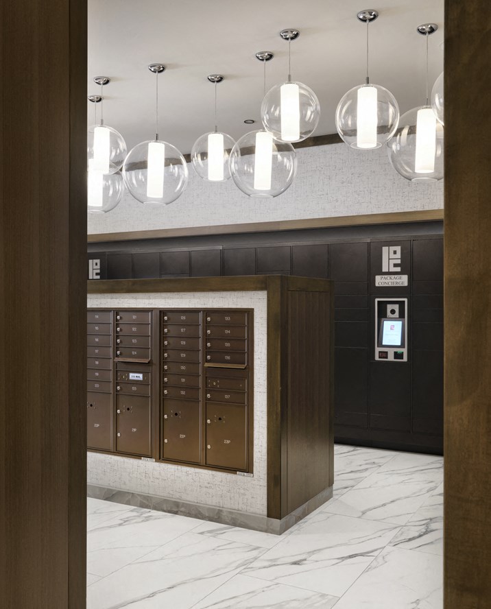 a large lobby with a bunch of lockers and lights