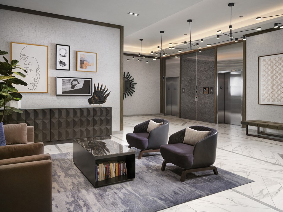 a lobby with couches and chairs and a coffee table