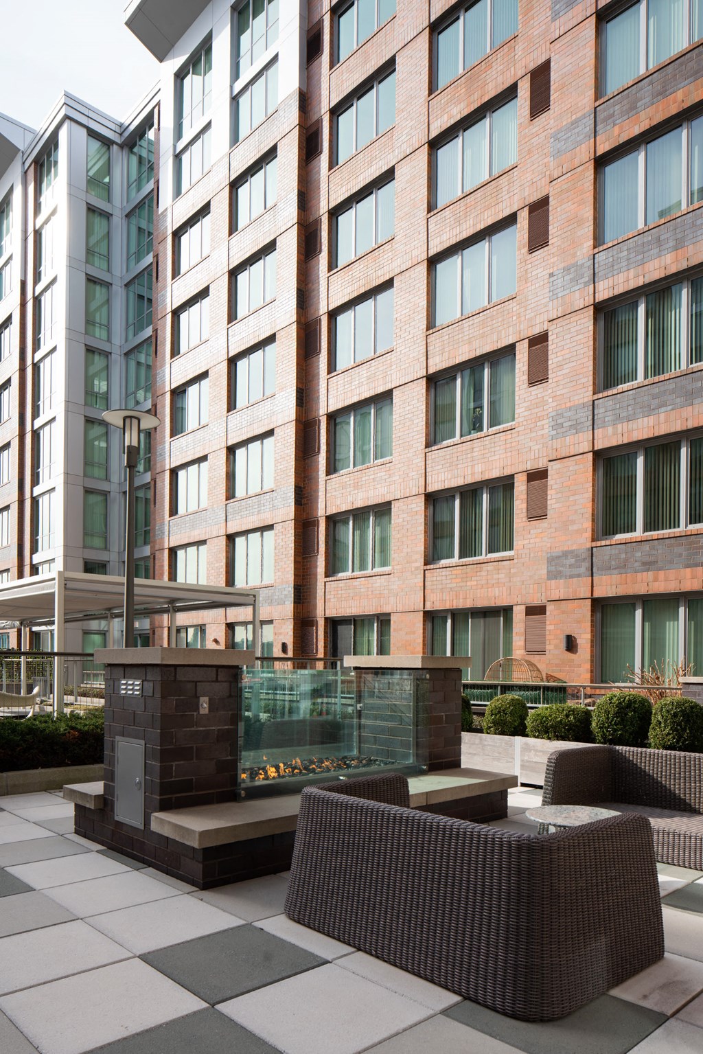 an outdoor patio area with a large building in the background