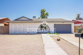 a home with a driveway and a garage door