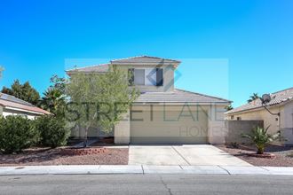 a house with a driveway and a street in front of it