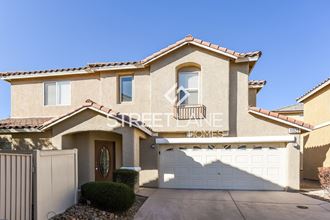a house with a garage and a white garage door