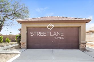 a streetlane homes garage door in front of a house