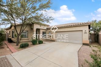 a home with a driveway and a garage door