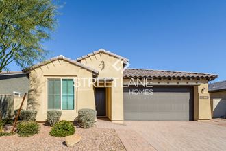 a single story home with a garage and a driveway