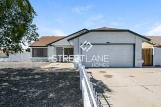 a house with a driveway and a garage door