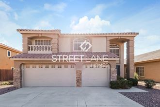 a home with a garage door and a street alliance homes sign on it
